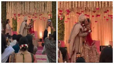 Priyanka Chopra's brother Siddharth Chopra kisses his bride Neelam Upadhyaya after jaimala ceremony- WATCH video